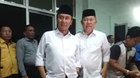 Mularis Djahri-Saidina Ali datang ke KPU Palembang saat penetapan sebagai paslon Pilkada Palembang (Liputan6.com / Nefri Inge)