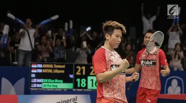 Ekspresi Ganda Campuran Indonesia, Tontowi Ahmad/Liliyana Natsir usai berhasil menambah angka saat laga melawan Tan Kian Meng-Lai Pei Jing (Malaysia) di perempat final Indonesia Open 2017 di Jakarta, Jumat (16/6). (Liputan6.com/Faizal Fanani)