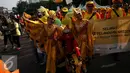 Sejumlah peserta parade mengenakan kostum tokoh pewayangan saat memperingati Hari Pelanggan Nasional 2016 di Kawasan Bundaran HI, Jakarta, Minggu (4/9). Kegiatan tersebut sebagai bentuk kepedulian bersama kepada pelanggan. (Liputan6.com/Johan Tallo)