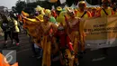 Sejumlah peserta parade mengenakan kostum tokoh pewayangan saat memperingati Hari Pelanggan Nasional 2016 di Kawasan Bundaran HI, Jakarta, Minggu (4/9). Kegiatan tersebut sebagai bentuk kepedulian bersama kepada pelanggan. (Liputan6.com/Johan Tallo)