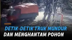 Insiden kecelakaan terekam CCTV, melibatkan sebuah truk yang mundur dengan cepat.