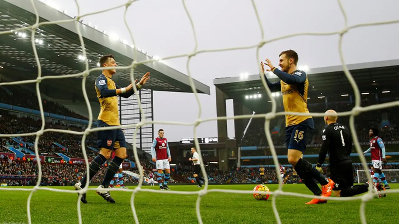 Dua bintang Arsenal, Mesut Ozil dan Aaron Ramsey (Liputan6.com)