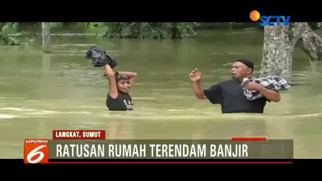 Ratusan rumah warga di Langkat, Sumatera Utara, terendam banjir hingga satu meter. Akibatnya, aktivitas warga terganggu.
