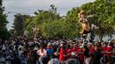Pawai ogoh-ogoh ini dilakukan untuk menyambut hari Raya Nyepi esok hari, Rabu, 22 Maret 2023.  (AFP/Juni Kriswanto)