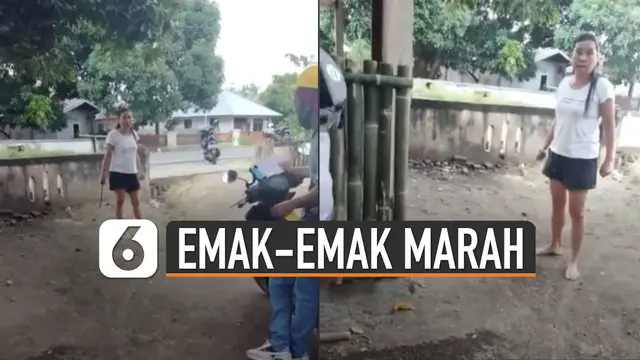 Seorang emak-emak terekam sedang marah-marah dan mengancam petugas PLN dengan senjata tajam.