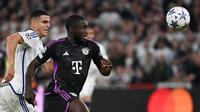 Dayot Upamecano didatangkan Bayern Munchen dari RB Leipzig pada awal musim 2021/2022 dengan nilai transfer 42,5 juta euro dan masih bertahan hingga kini. Ia total telah bermain dalam 154 laga di semua kompetisi bersama Bayern Munchen dengan torehan 4 gol dan 3 assist. Bersama Timnas Prancis, bek tengah berusia 25 tahun ini telah mengoleksi 25 caps dengan torehan 2 gol. (AFP/Sergei Gapon)