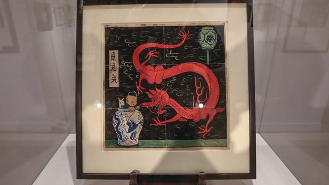 Lukisan Tintin bertajuk "The Blue Lotus" karya ilustrator asal Belgia, Hergé, berhasil laku terjual dengan harga Rp 66 Miliar dan memecahkan rekor. (Photo credit: AP Photo/Michel Euler)