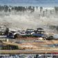 Tsunami yang menerjang kawasan Fuskushima di timur laut Jepang pada tahun 2011 (AP/Kyodo)