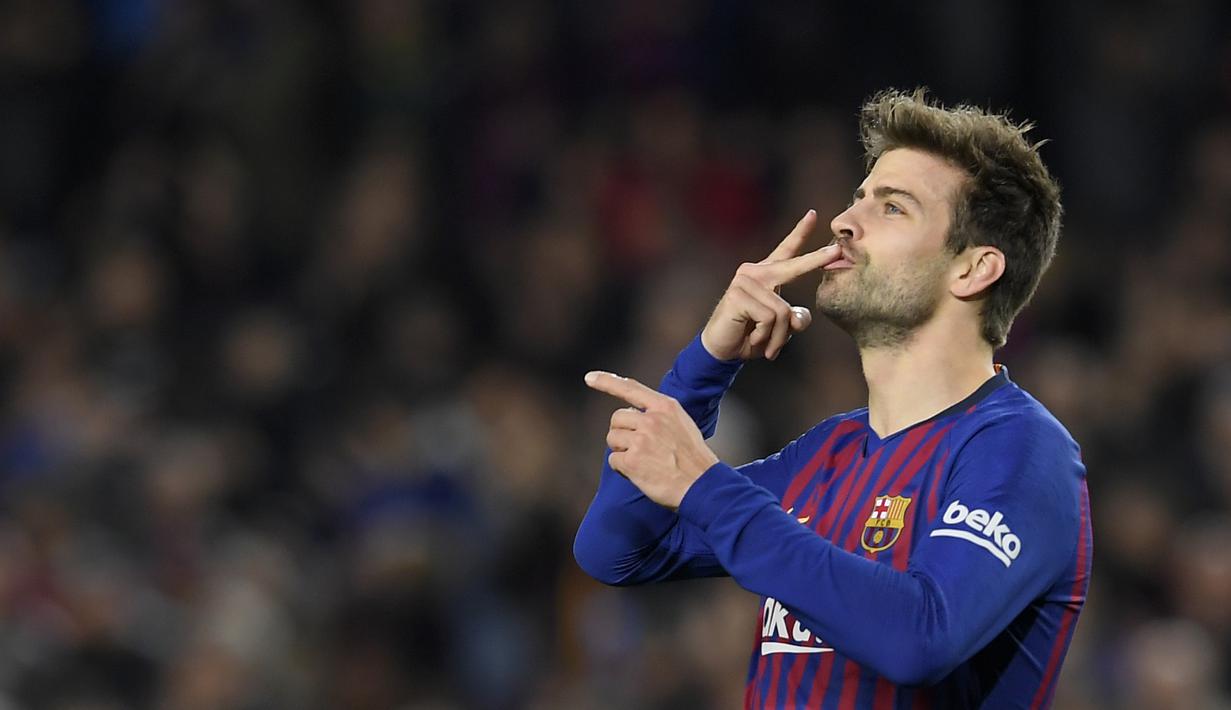 7. Gerard Pique – Mantan pemain Manchester United ini telah mengemas total 30 piala. Sebanyak 27 trofi diraihnya bersama Blaugrana. (AFP/Lluis Gene)