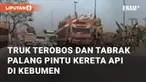 Truk menabrak palang pintu kereta api yang sedang menutup. Peristiwa ini berada di Karanganyar, Kebumen