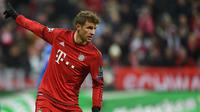 4. Meskipun terus menolak jika dikatakan akan pindah dari Bayern Munchen. Hal itu tidak membuat Manchester City berhenti menggoda striker asal Jerman, Thomas Muller untuk kembali bermain bersama Guardiola. (AFP/Christof Stache)