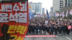 Mereka mendesak pemakzulan Presiden Korea Selatan Yoon Suk Yeol. (ANTHONY WALLACE/AFP)