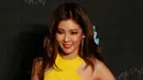 Penyanyi Korea Selatan, Hyuna berpose di karpet merah Mnet Asian Music Awards (MAMA) 2015 di Hong Kong, Rabu (2/12). Personel girlsband 4Minute itu tampil mengenakan mini dress berwarna kuning. (REUTERS/Bobby Yip)