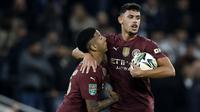 Gelandang Manchester City, Matheus Nunes, merayakan gol yang dicetaknya ke gawang Tottenham Hotspur di babak 16 besar Carabao Cup, Kamis (31/10/2024) dini hari WIB. Sayangnya, Man City kalah dan tersingkir dari kompetisi. (BENJAMIN CREMEL / AFP)