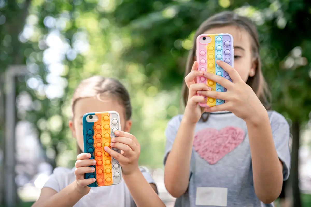 Kids playing with their gadget