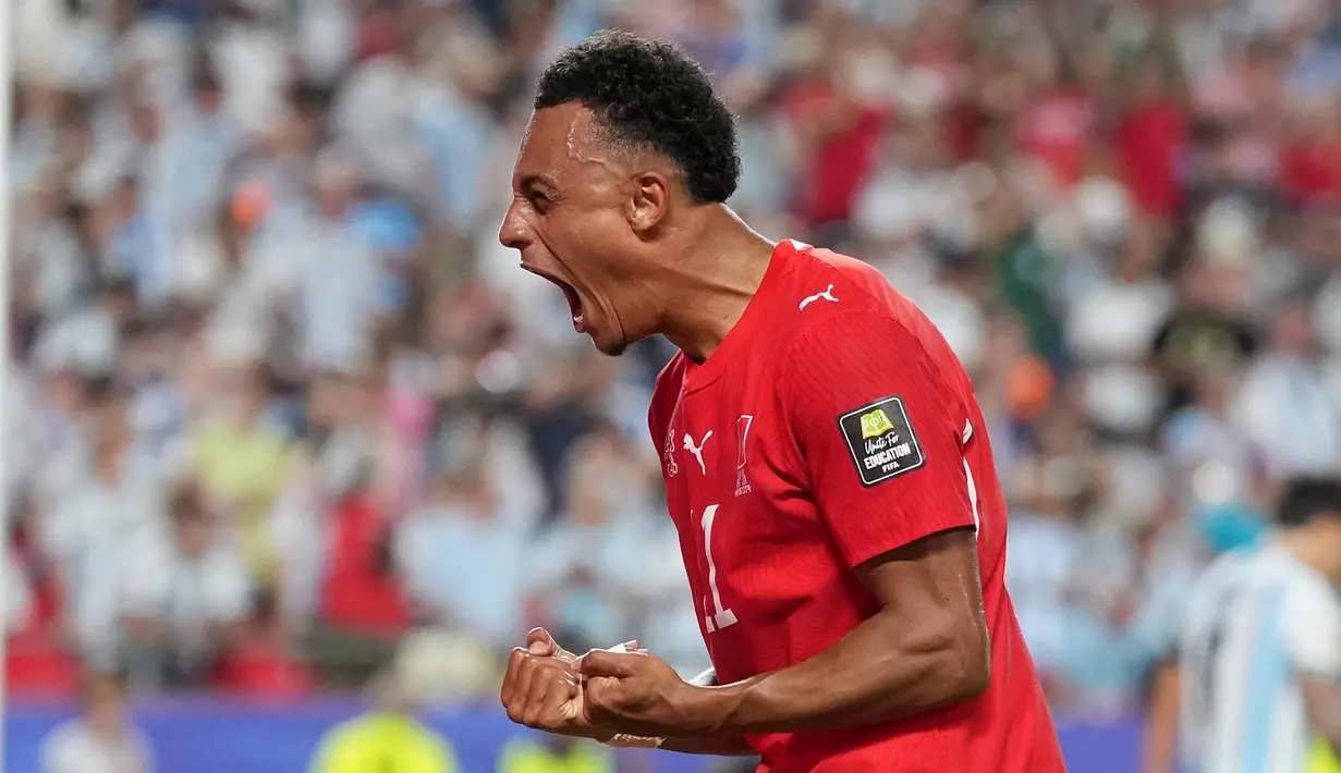 Pemain Swiss Dan Ndoye merayakan gol pertama timnya selama pertandingan perempat final Piala Dunia antara Argentina dan Swiss di Kansas City, Mo., Sabtu, 11 Juli 2026. (AP Photo/Abbie Parr)