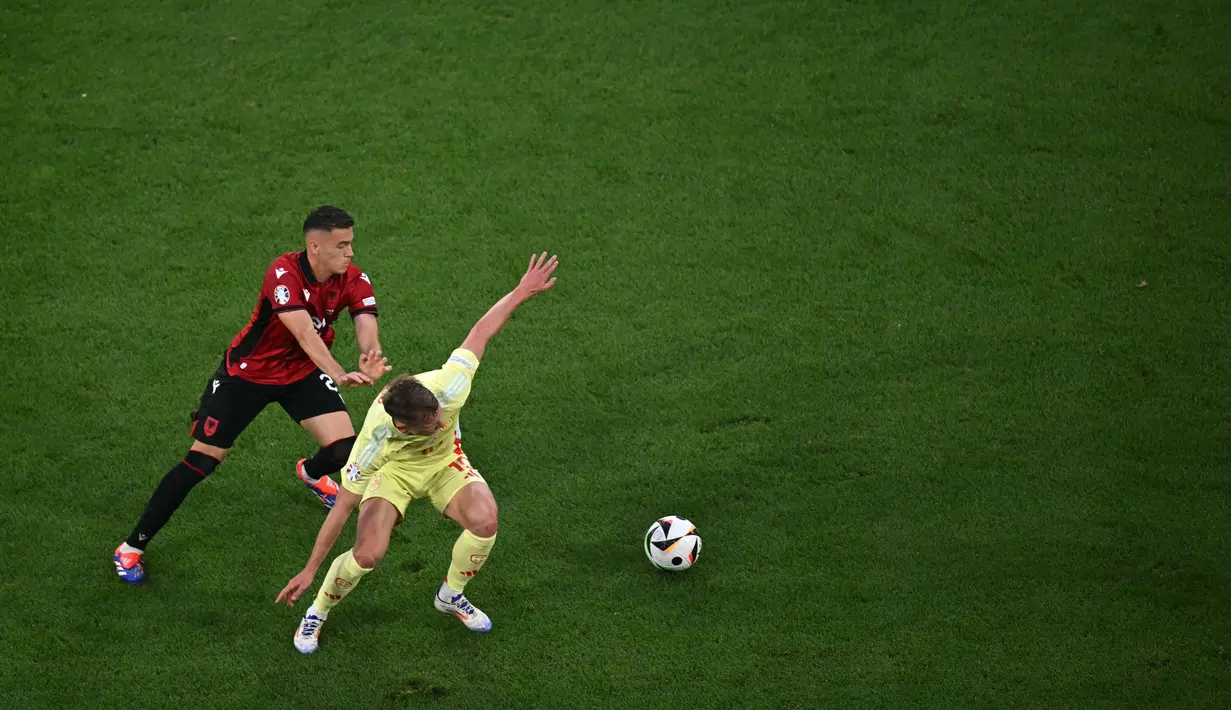 Hasil ini berarti Spanyol berhasil memenangi tiga pertandingan di fase grup, 9 poin dari 3 laga. (OZAN KOSE / AFP)