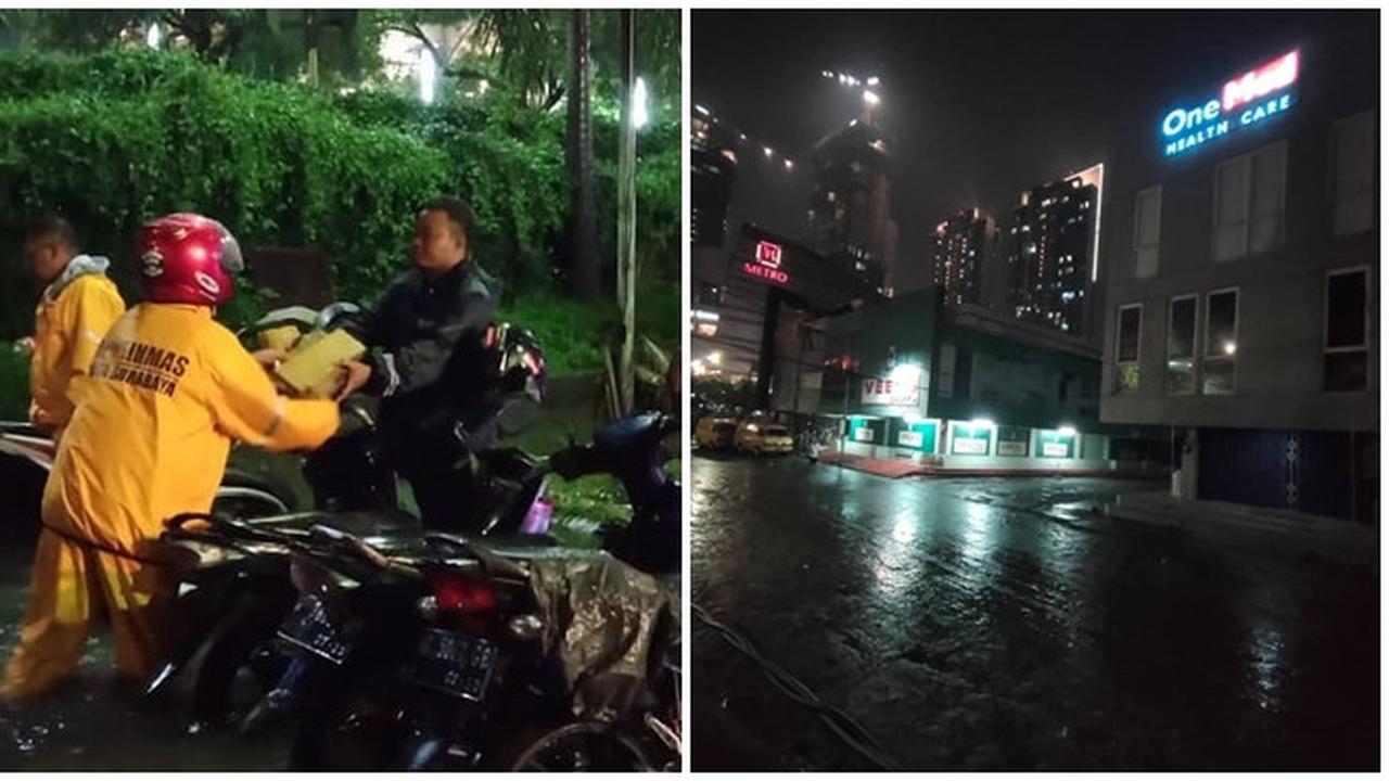 Petugas Bantu Bersihkan Saluran di Kota Surabaya