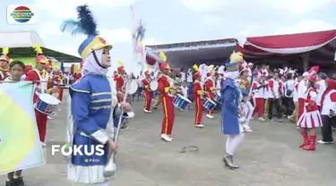 Obor Api Asian Games 2018 disambut pertunjukan marching band saat sampai di Penukal Abab Lematang Ilir, Sumatra Selatan.