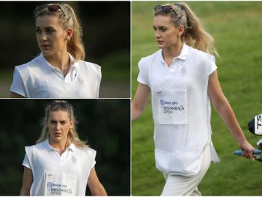 Definisi caddie menurut Wikipedia adalah the person who carries a player's bag and clubs, and gives insightful advice and moral support, almost like a coach. Di turnamen BRI Indonesia Open 2019 lalu, keberadaan caddie cantik menjadi daya tarik tersendiri. (Bola.com/Peksi Cahyo)