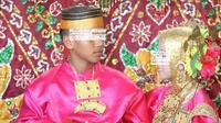Sepasanga anak di bawah umur melangsungkan pernikahan di Mamuju (Foto: Liputan6.com/Istimewa)