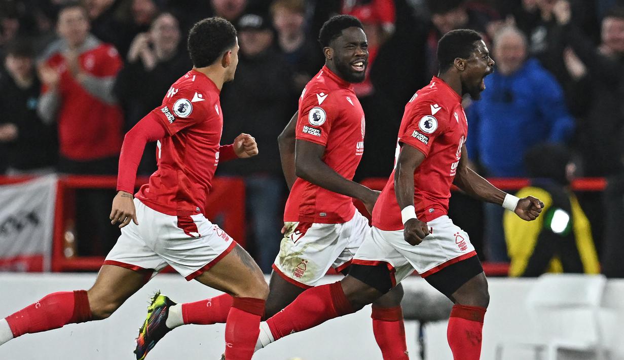 Sebagai tim promosi di Liga Inggris musim ini, Nottingham Forest melakukan belanja besar-besaran dengan banyak mendatangkan pemain baru dari berbagai negara, seperti para pemain asal Afrika. Tercatat Dari total 39 pemain dalam skuad Nottingham Forest musim 2022/2023 ini, Forest memiliki 7 pemain Afrika yang menjadi terbanyak kedua setelah pemain lokal Inggris sendiri yang berjumlah 13 pemain. Berikut ketujuh pemain asal Afrika tersebut. (AFP/Paul Ellis)