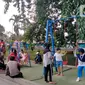 Anak-anak bermain di Alun-Alun Kota Bogor, Jawa Barat, Senin (26/9/2022). Dulunya Alun-alun Kota Bogor bernama Taman Wihelmina, setelah itu sempat berubah fungsi menjadi terminal dan Taman Ade Irma Suryani. (Liputan6.com/Magang/Aida Nuralifa)