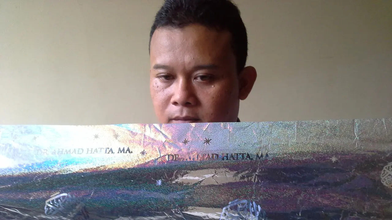 Terompet bergambar tulisan Arab