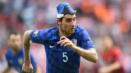 Vedran Corluka berasal dari Bosnia dan Herzegovina tetapi pada tahun 1992 keluarganya pindah ke Zagreb, Kroasia, akibat konflik di negara asalnya. Dia mulai tampil untuk Timnas Kroasia sejak dipanggil Timnas U-21. (AFP/Bulent Kilic)