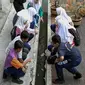 Sekolah di Ipoh, Perak, Malaysia, budi dayakan ikan di selokan sekolah. (dok. GPS Bestari)