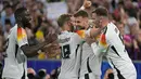 Penyerang Jerman #09 Niclas Fuellkrug (kanan tengah) berselebrasi dengan rekan setimnya setelah mencetak gol ke gawang Skotlandia pada matchday 1 Grup A Euro 2024 di stadion Allianz Arena, Sabtu (15/6/2024). (DAMIEN MEYER / AFP)