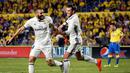 Striker Real Madrid, Karim Benzema, merayakan gol ke gawang Las Palmas dalam lanjutan La Liga di Gran Canaria, Las Palmas, Minggu (25/9/2016) dini hari WIB. (AFP/Desiree Martin)