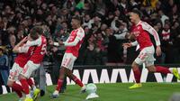 Bertanding di Emirates Stadium pada Sabtu 14 Maret 2026 waktu setempat atau Minggu (15/3/2026) dini hari WIB, The Gunners unggul lewat dua gol di penghujung laga. Tampak dalam foto, para pemain Arsenal merayakan gol saat pertandingan lanjutan Premier League musim 2025/2026 melawan Everton di Emirates Stadium, Inggris, Sabtu 14 Maret 2026 waktu setempat atau Minggu (15/3/2026) dini hari WIB. (AP Photo/Kin Cheung)