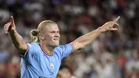 Ekspresi kegembiraan striker Manchester City, Erling Haaland, saat laga kontra Sevilla pada matchday pertama Grup G Liga Champions 2022/2023 di Stadion Ramon Sanchez Pizjuan, Rabu (7/9/2022) dini hari WIB. (Cristina Quicler/AFP)
