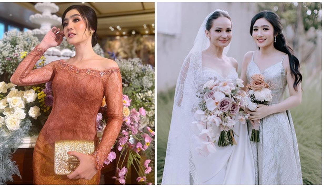 Ketika pernikahan Enzy Storia, Febby Rastanty juga mengenakan busana berbeda saat akad nikah dan resepsi pernikahan di Bali. Ketika akad nikah, artis kelahiran 1996 ini kenakan kebaya warna pink kecokelatan dengan tatanan rambu disanggul. Tampil lebih simpel, Febby pakai dress warna abu-abu dengan gaya rambut ikat tengah saat resepsi pernikahan Enzy Storia di Bali. (Liputan6.com/IG/@febbyrastanty)