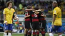 Pada Piala Dunia 2014, Joachim Loew membawa Jerman tampil sebagai kampiun. Tuan rumah Brasil di hancurkan 7-1 di babak semifinal yang menjadi kekalahan teburuk tim Samba sepanjang sejarah Piala Dunia. (AFP/Adrian Dennis)