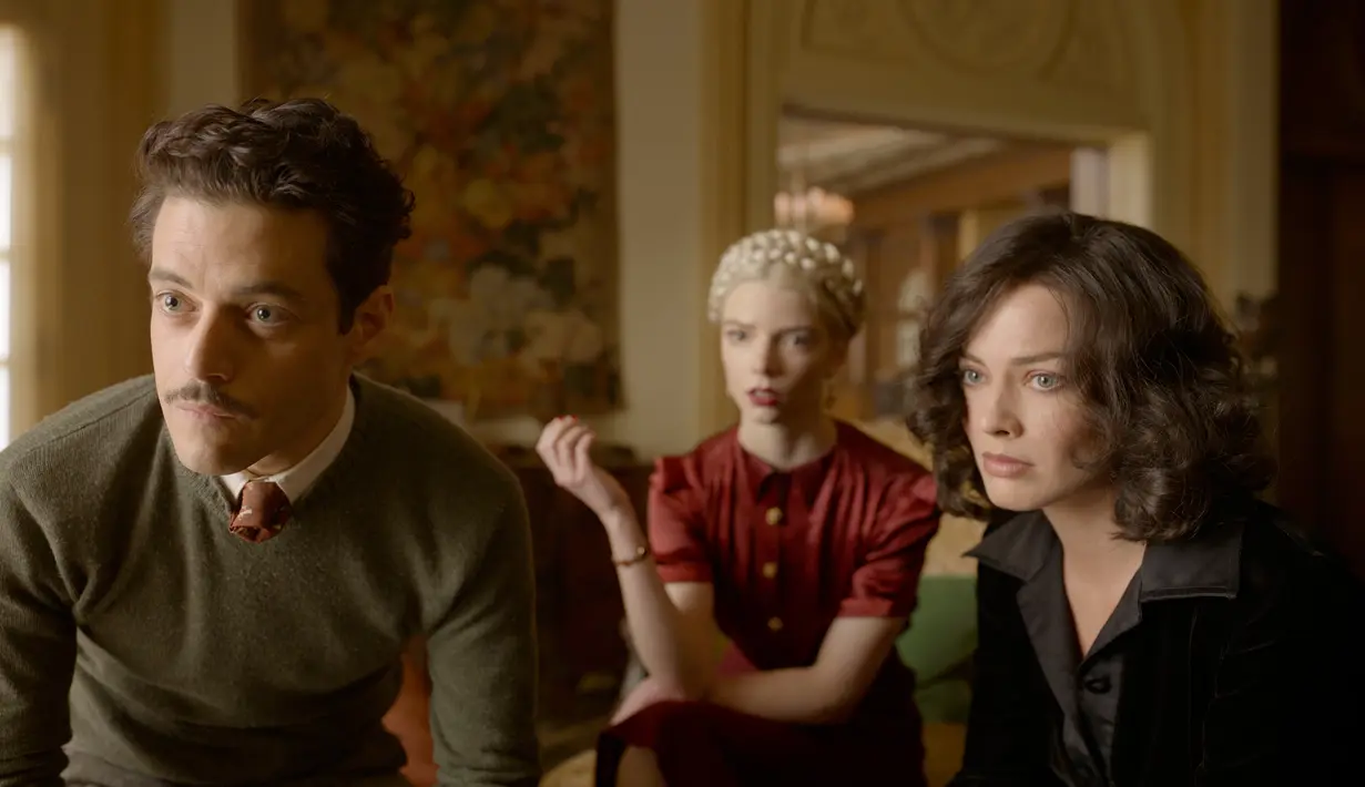(kiri ke kanan) Rami Malek, Anya Taylor-Joy, dan Margot Robbie dalam sebuah adegan dari film 'Amsterdam'. Film berdurasi 2 jam 14 menit ini akan ditayangkan di bioskop pada 7 Oktober 2022 mendatang. (20th Century Studios via AP)