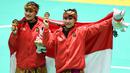 Pesilat Indonesia, Ayu Sidan Wilantari dan Ni Made Dwiyanti, melakukan selebrasi usai menjadi juara pada Asean Games di Padepokan TMII, Jakarta, Rabu (29/8/2018). Ayu/Made berhasil meraih emas pada nomor seni ganda putri. (Merdeka.com/Imam Buhori)