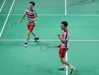 Ekspresi Kevin Sanjaya/Marcus Gideon meraih poin atas Mads Conrad/Mads Pieler pada perempat final ganda putra Indonesia Open 2018 di Istora Senayan, Jakarta, (6/6/2018). Kevin/Marcus menang 20-22, 22-20, 21-18. (Bola.com/Nick Hanoatubun)