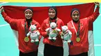 Tim pencak silat seni beregu putri Indonesia, Pramudita Yuristya (kiri), Lutfi Nurhasanah (tengah) dan Gina Tri Lestari (kanan) berpose usai meraih medali emas Asian Games 2018, Jakarta, Rabu (29/8). (ANTARA FOTO/INASGOC/Melvinas Priananda/nak/18)