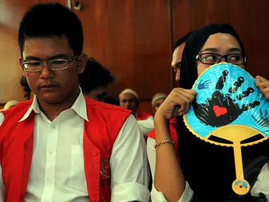 Dua tersangka kasus pembunuhan Ade Sara menjalani sidang di Pengadilan Negeri Jakarta Pusat, (16/9/14). (Liputan6.com/Faisal R Syam)