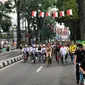 Presiden Jokowi mengikuti Gowes Bandung Lautan Sepeda di Jalan Diponegoro, Citarum, Bandung Wetan, Kota Bandung, Jawa Barat, Sabtu (10/11/2018). (Liputan6.com/Titin Supriatin)