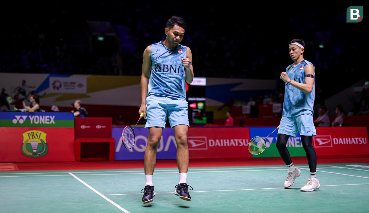 <p>Selebrasi ganda putra Indonesia, Fajar Alfian/Muhammad Rian Ardianto setelah meraih angka saat menghadapi pasangan Chinese Taipei pada laga babak 32 besar Daihatsu Indonesia Masters 2024 di Istora Senayan, Jakarta, Selasa (23/1/2024). Fajar Alfian/Muhammad Rian Ardianto menang dua game langsung 21-16, 21-14. (Bola.com/Bagaskara Lazuardi)</p>