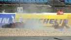 Pembalap Ducati, Jack Miller mengalami selip ban dan terjatuh pada lap 19 dalam MotoGP Portugal di Sirkuit Algarve, Portimao, Minggu (24/4/2022). (AFP/Patricia De Melo Moreira)