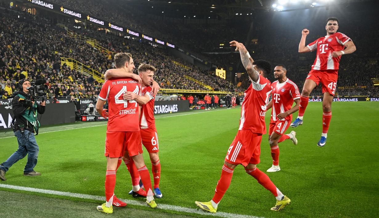 Hasil itu membuat Die Roten kukuh di puncak klasemen sementara dengan koleksi 63 poin atau terpaut 11 angka dari peringkat kedua yang dihuni Borussia Dortmund. (AFP/Ina Fassbender)