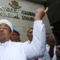 Pimpinan Front Pembela Islam (FPI) Rizieq Shihab tiba di Polda Metro Jaya, Jakarta, untuk diperiksa sebagai saksi kasus dugaan makar, Rabu (1/2). (Liputan6.com/Immanuel Antonius)