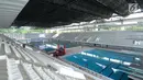 Tampilan salah satu sisi Stadion Aquatik Gelora Bung Karno pasca dilakukan renovasi, Jakarta, Jumat (10/11). Stadion khusus cabang olah raga renang ini memiliki empat kolam renang dengan berbagai ukuran. (Liputan6.com/Helmi Fithriansyah)