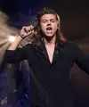 Bintang One Direction, Harry Styles telah keluar dari tim manajemen band, Modest Management, untuk menandatangani dengan Jeffrey Azoff Creative Artists Agency (CAA) untuk melakukan solo karir. (AFP/Bintang.com)