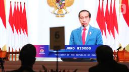 Presiden Joko Widodo memberi sambutan secara virtual pada 
diskusi informal Forum B20 yang diikuti delegasi anggota G20, di Jakarta, Kamis (27/1/2022). Untuk menggenjot pertumbuhan ekonomi dunia diperlukan prinsip keberlanjutan lingkungan guna mencegah pemanasan global. (Liputan6.com/HO/Alwi)