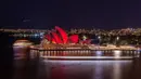 The Sydney Opera House berwarna merah untuk memperingati Hari Inklusi di Sydney, Australia, Jumat (20/7). (Wendell Teodoro/Light Up For Inclusion/AFP-Services)